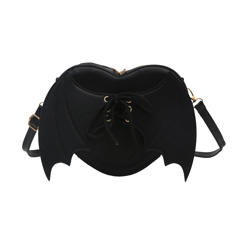 Black bat-wing shaped bag on a white background