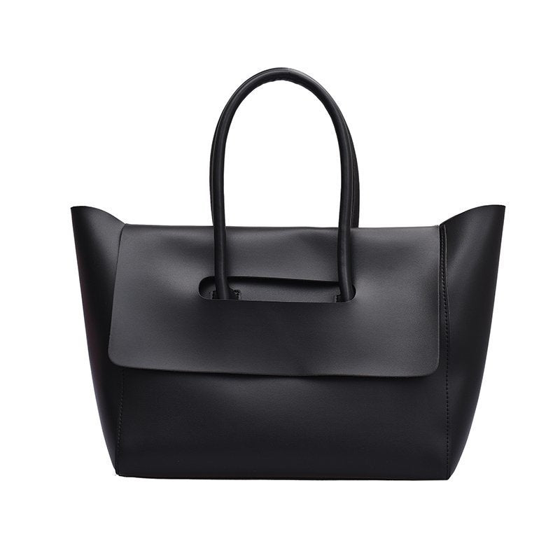 Black handbag on a white background