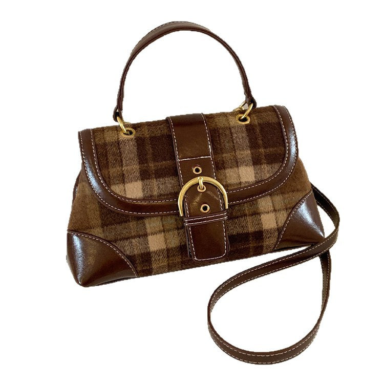 Brown plaid handbag with gold accents on a white background