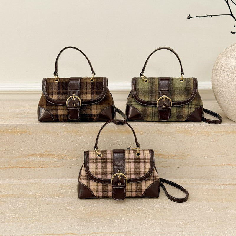 Three plaid handbags on a wooden surface with a neutral background