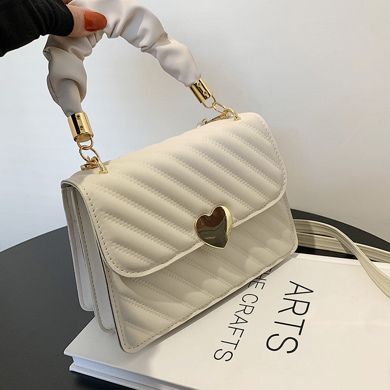 White women chain shoulder bag with magnetic closure and soft PU leather