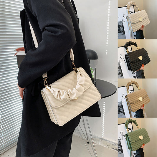 Collage of a beige handbag with ruffled details held by a person in a black coat.